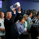 President Donald Trump tosses paper towels into a crowd as he hands out supplies at Calvary Chapel in Guaynabo, Puerto Rico, on Oct. 3, 2017. (Evan Vucci/AP Images)